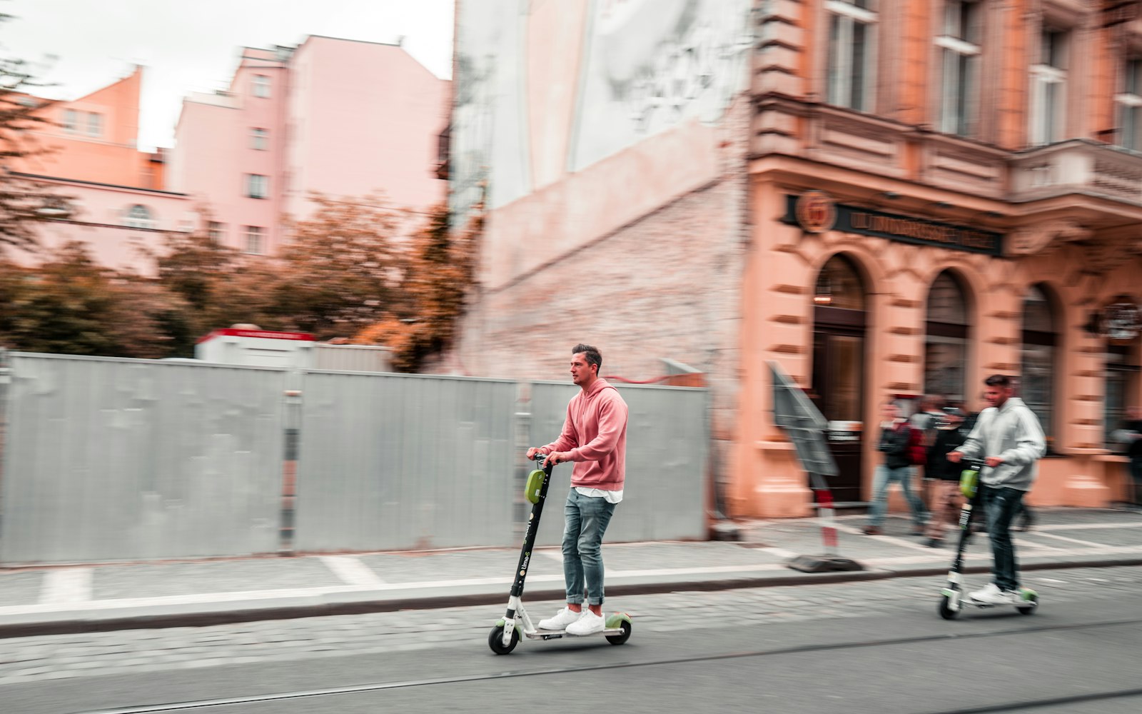 Moped and e-bike riders on a city street, the kind of crash a moped accident lawyer in Rosedale handles