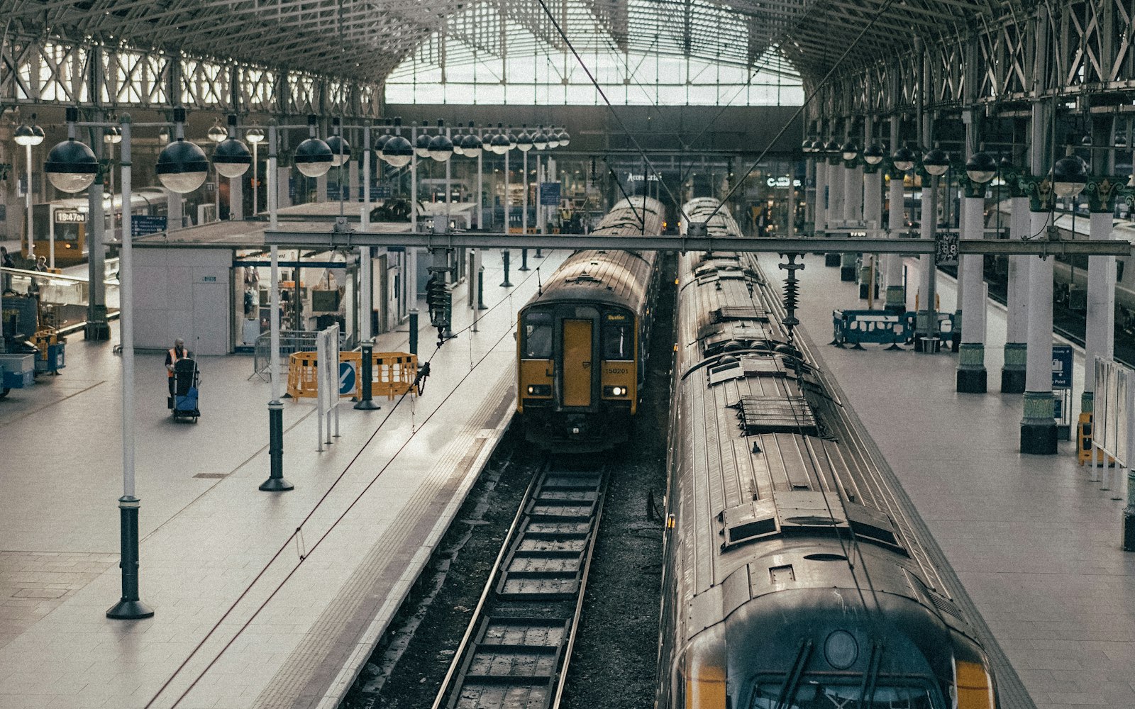 Commuter train at a station platform, where many injuries a New York train accident lawyer handles take place
