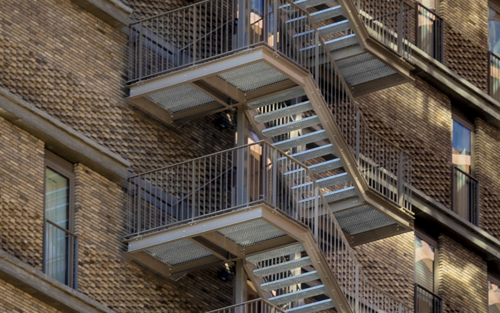 Apartment building stairwell with handrail, the kind of hazard a premises liability lawyer in Rosedale investigates