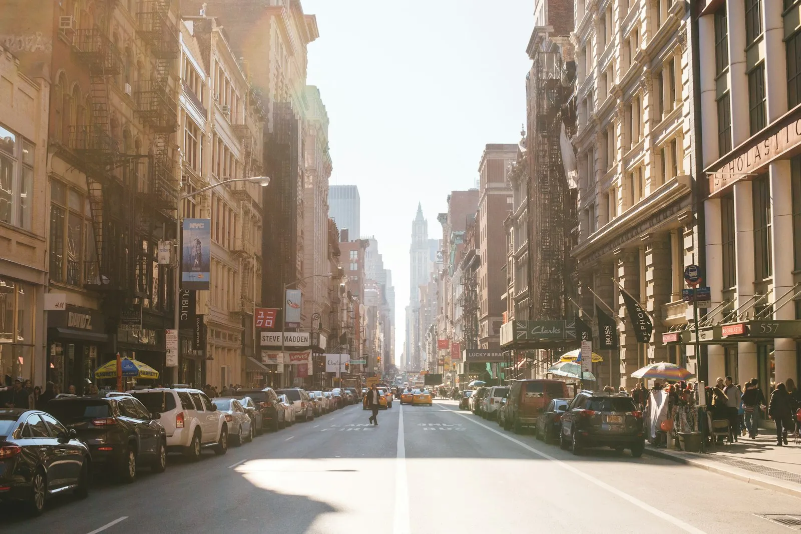 Car accident lawyer Astoria: person walking on a street beside parked cars