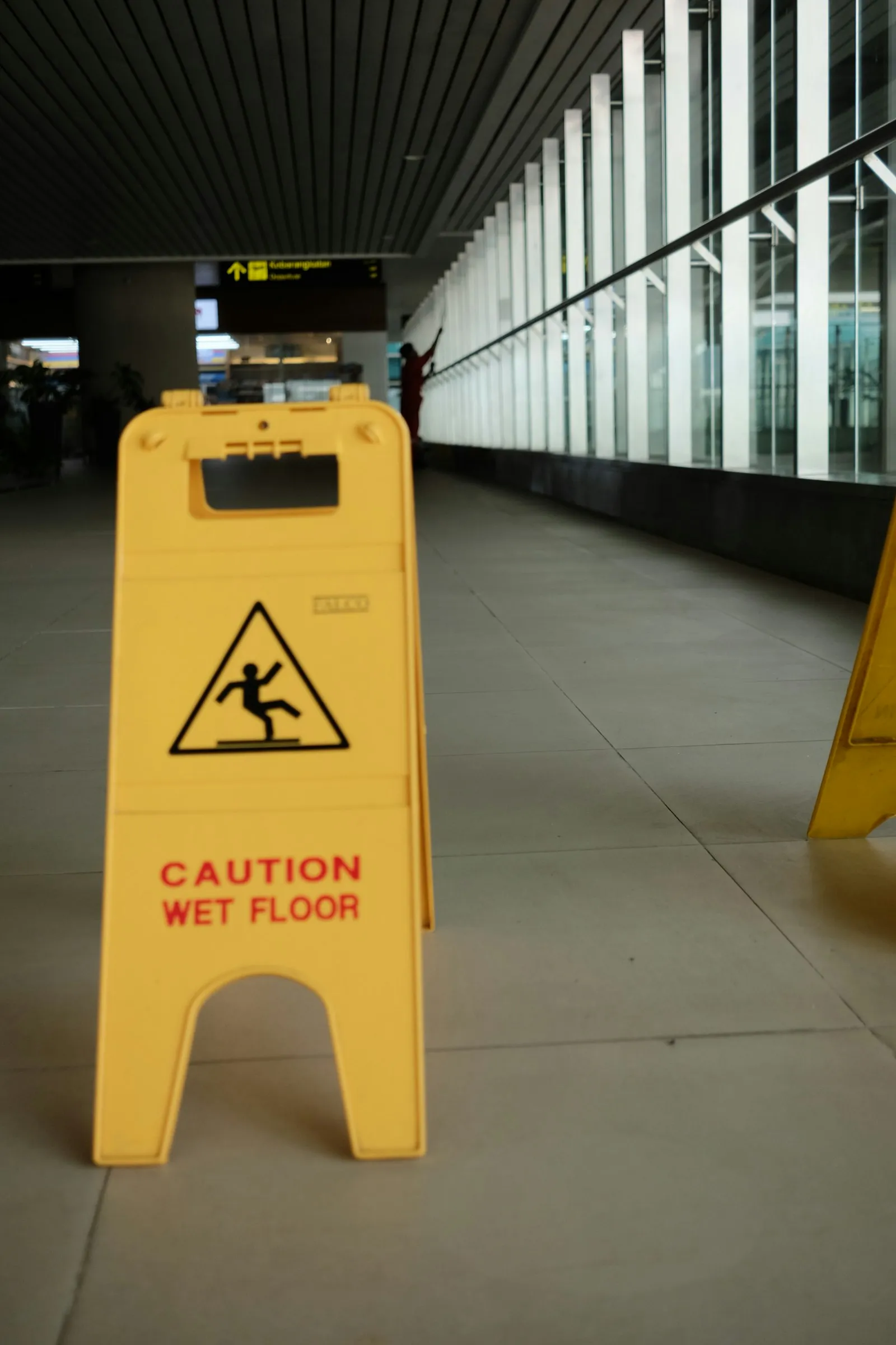 Queens slip and fall lawyer: caution wet floor sign inside a building