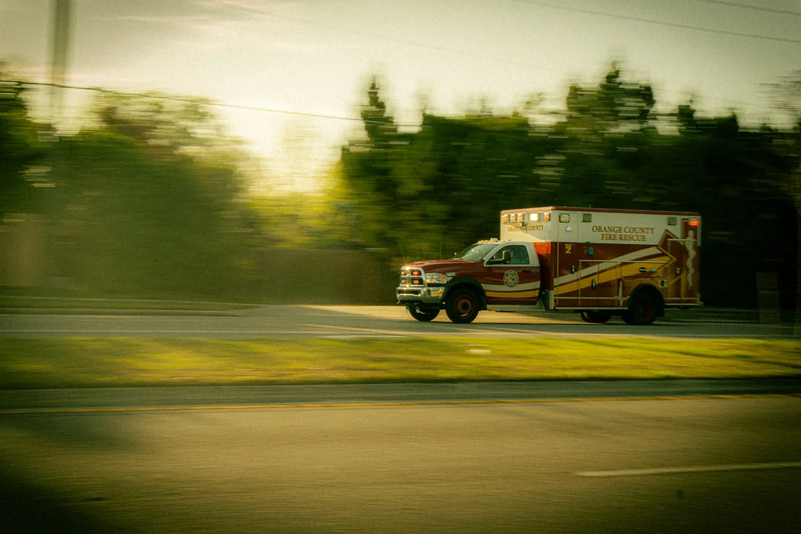 18 Wheeler Accident Lawyer in Bellerose – ambulance responding on a busy road
