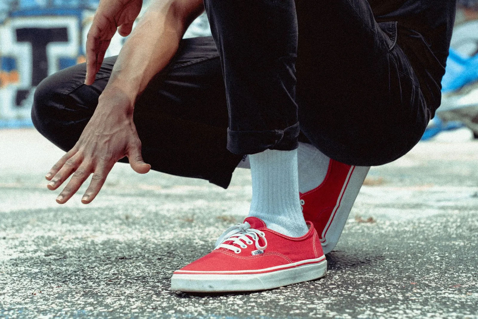 Person crouching on pavement holding an ankle after a fall, the kind of scene an ankle injury attorney reviews
