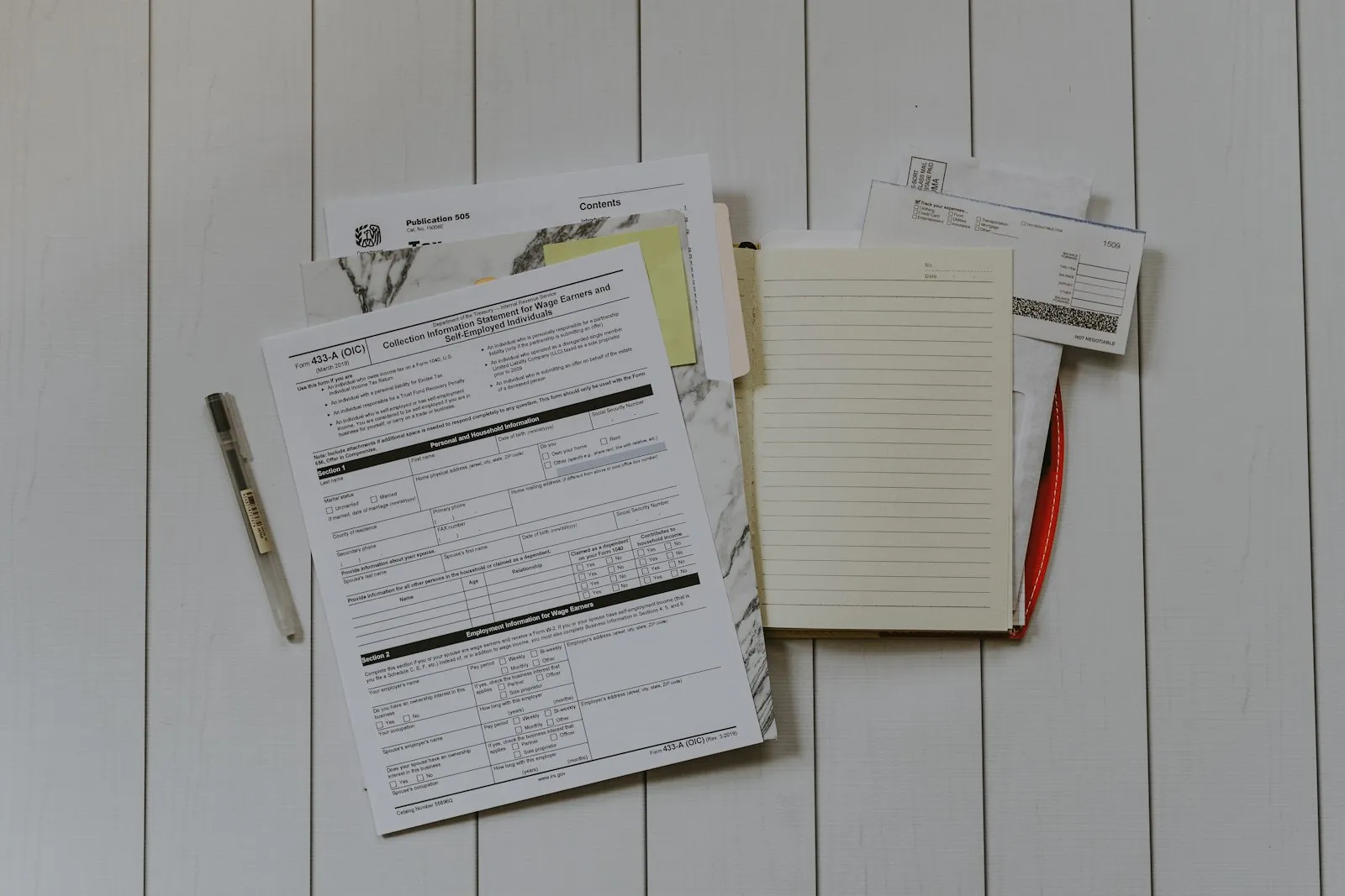 Auto Accident Lawyer in Bellerose – stack of insurance and no-fault paperwork