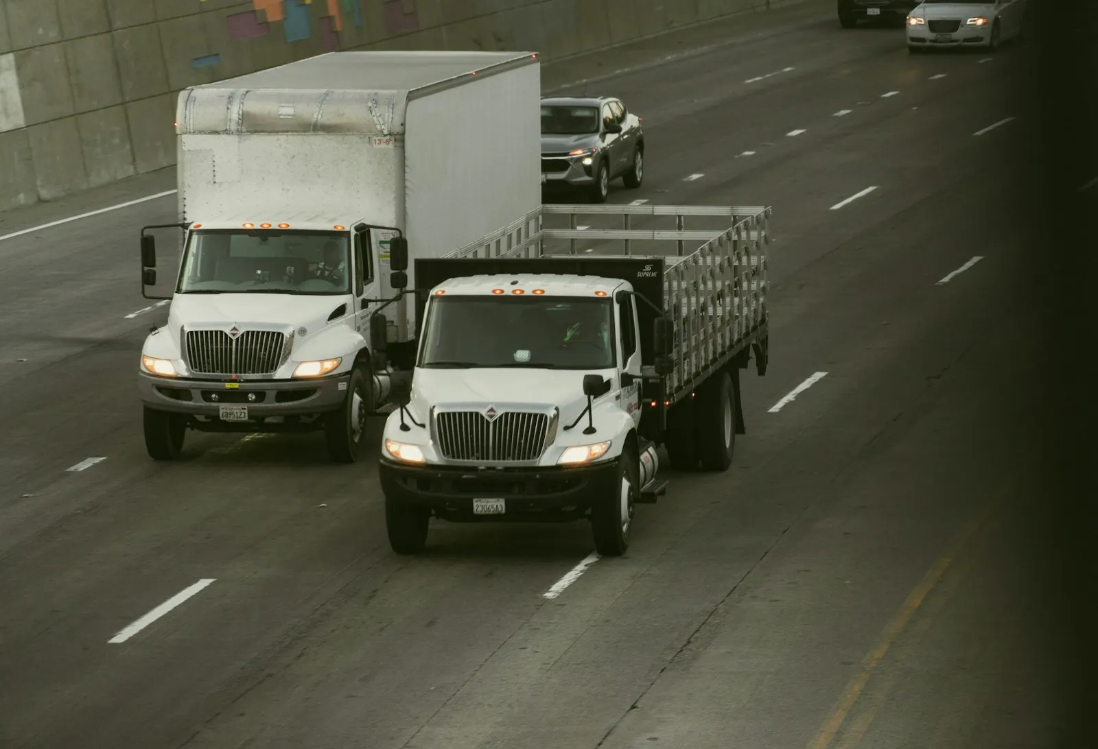 Box Truck Accident Lawyer in Bellerose – two white trucks driving on a road