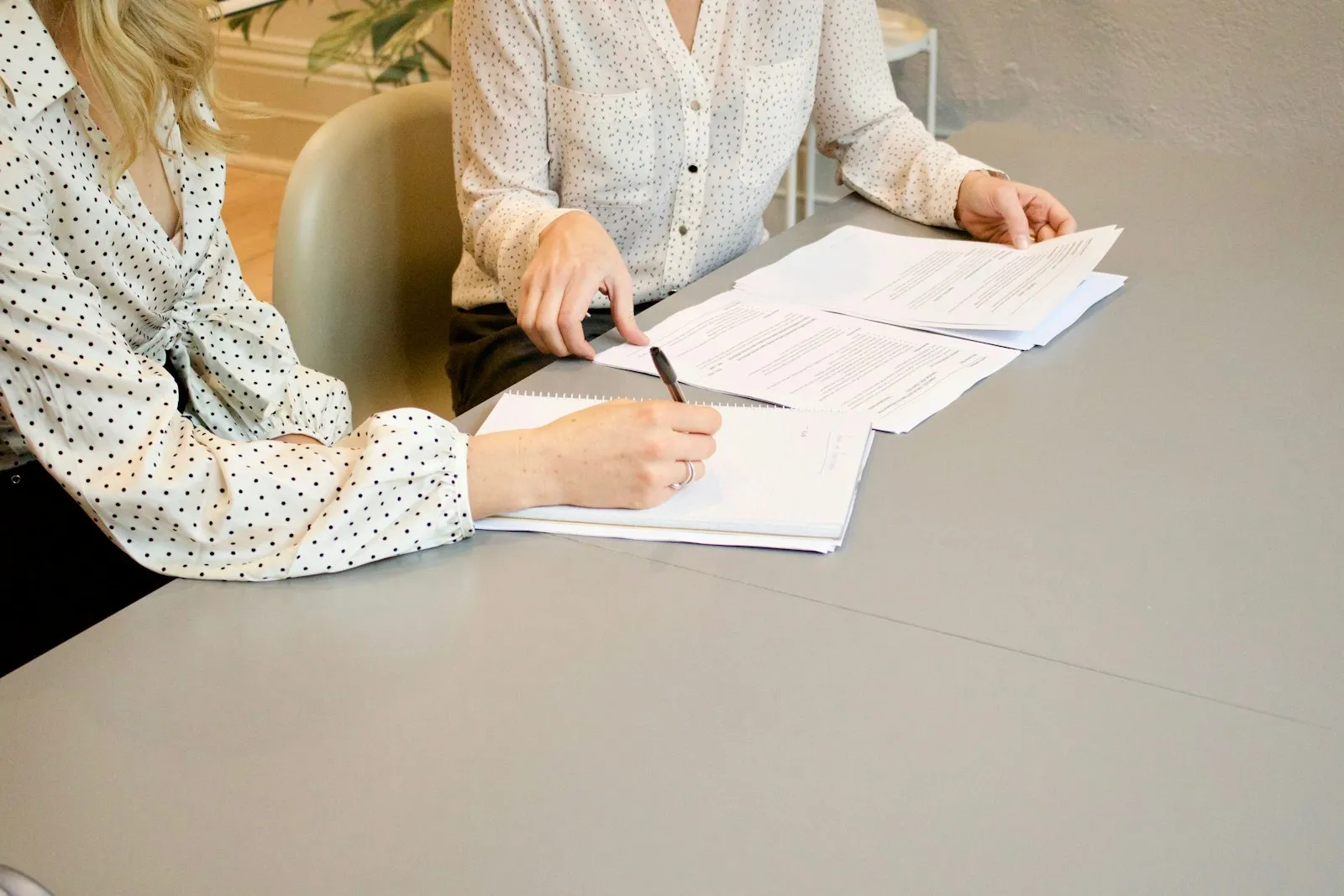 Car Accident Lawyer in Bellerose – client reviewing and signing documents
