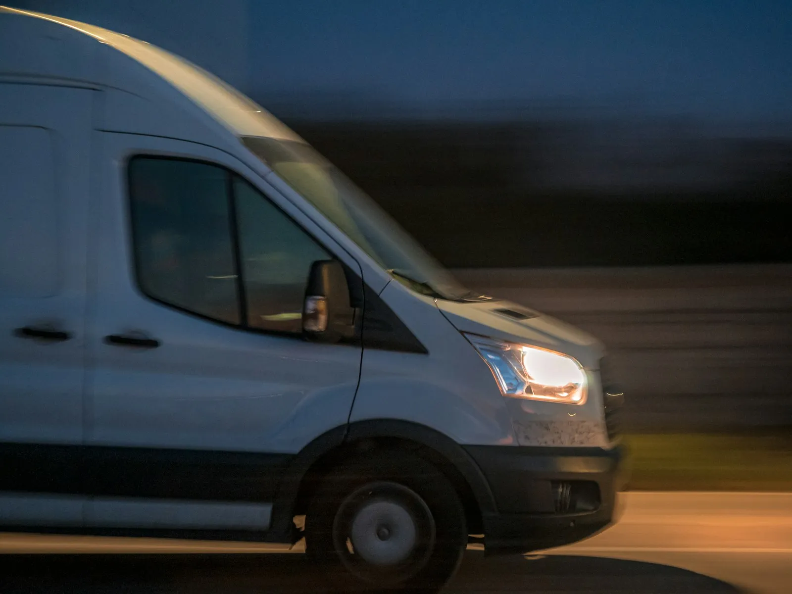 Delivery Truck Accident Lawyer in Bellerose – white delivery van driving down a street