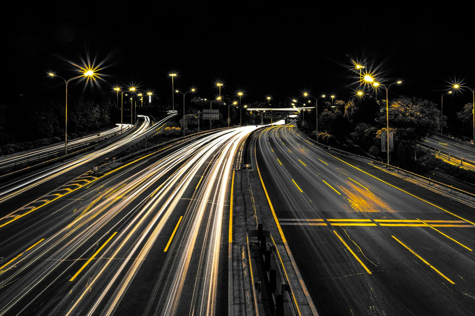 Highway at night with long light trails from traffic, the late hours when drowsy crashes a lawyer handles often happen