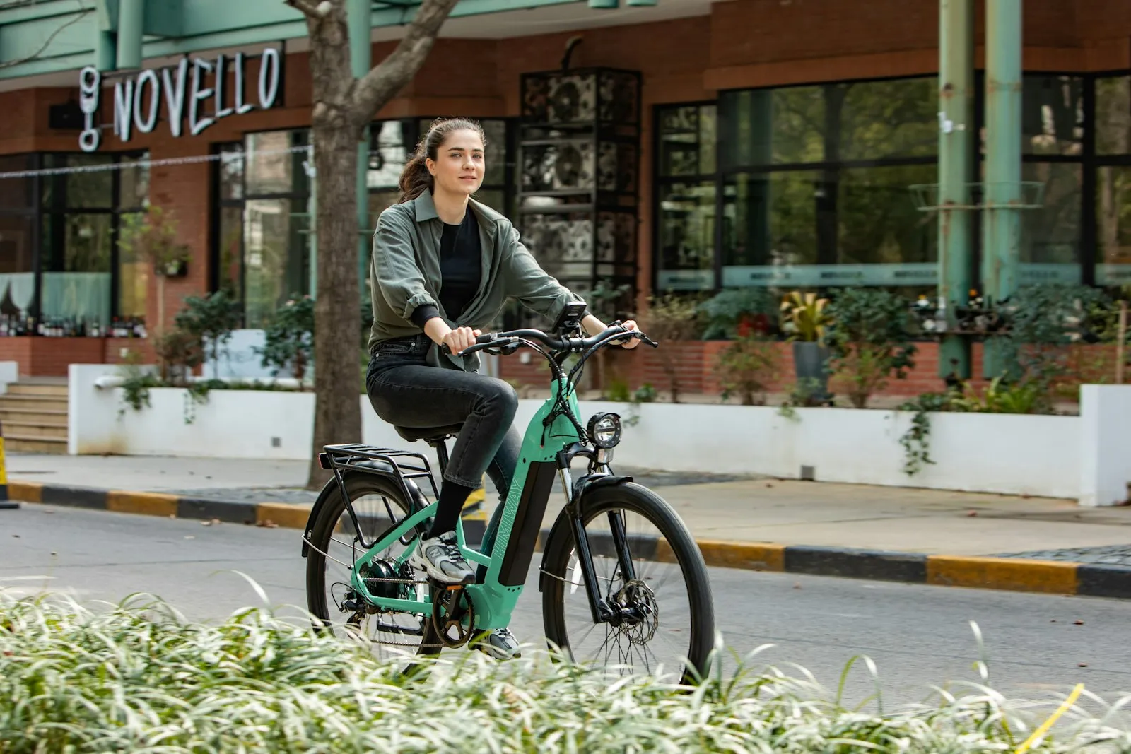 E-Bike Accident Lawyer in Bellerose – rider heading down a neighborhood street