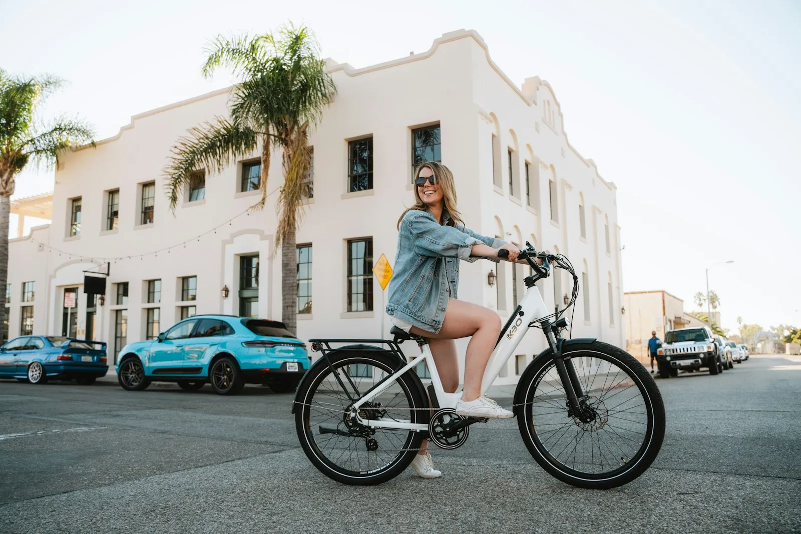 Electric Bike Accident Lawyer in Bellerose – woman riding an electric bike on a city street