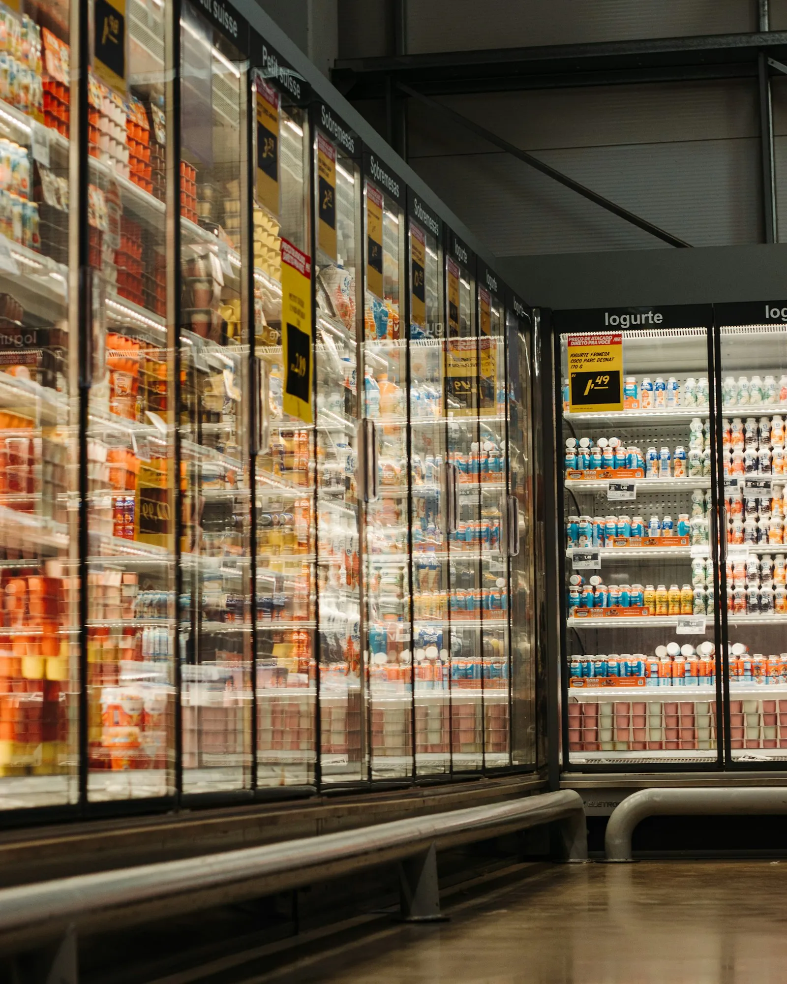 Freezer aisle with glass-door cases in a supermarket, a frequent focus for a grocery slip and fall lawyer