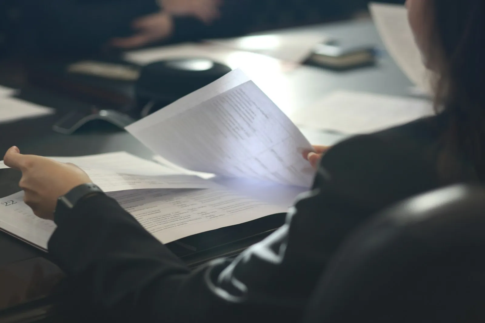 Intersection Accident Lawyer in Bellerose – meeting at a table to review paperwork