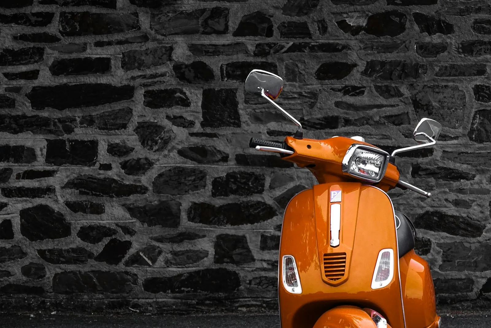 Moped Accident Lawyer in Bellerose – orange motor scooter parked by a building