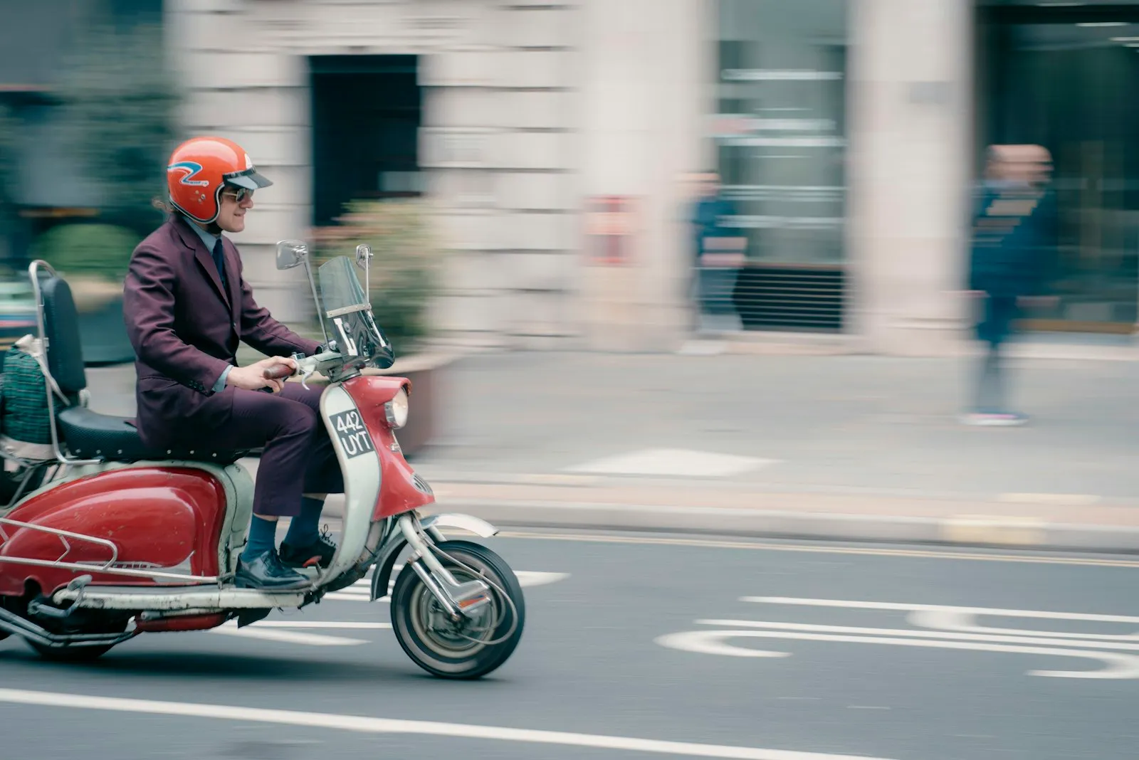 Moped Accident Lawyer in Bellerose – person riding a moped on the road