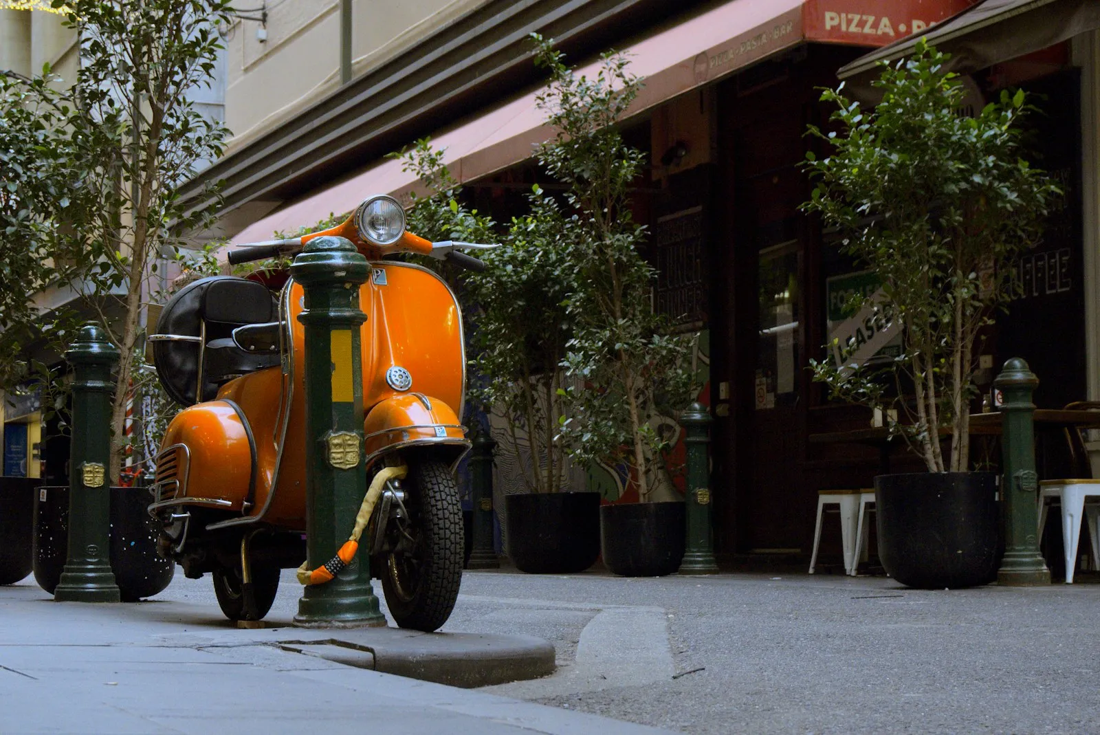 Moped Accident Lawyer in Bellerose – orange moped parked by the road