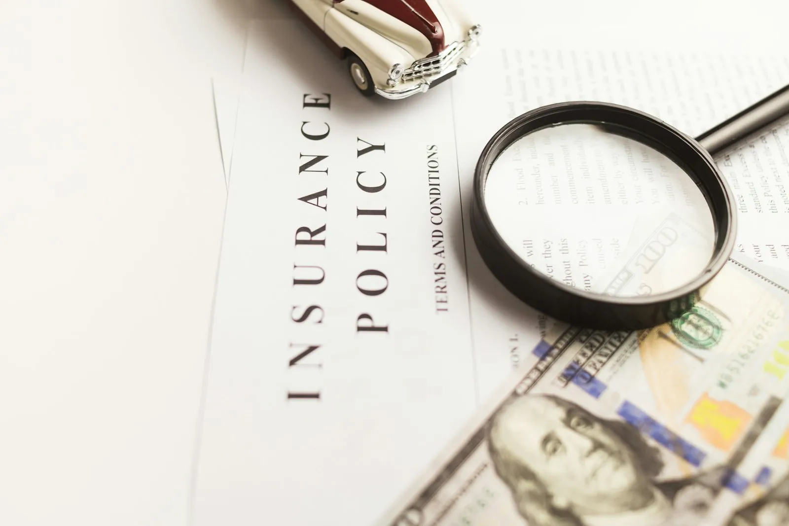 Motor Vehicle Accident Lawyer in Bellerose – magnifying glass over insurance documents