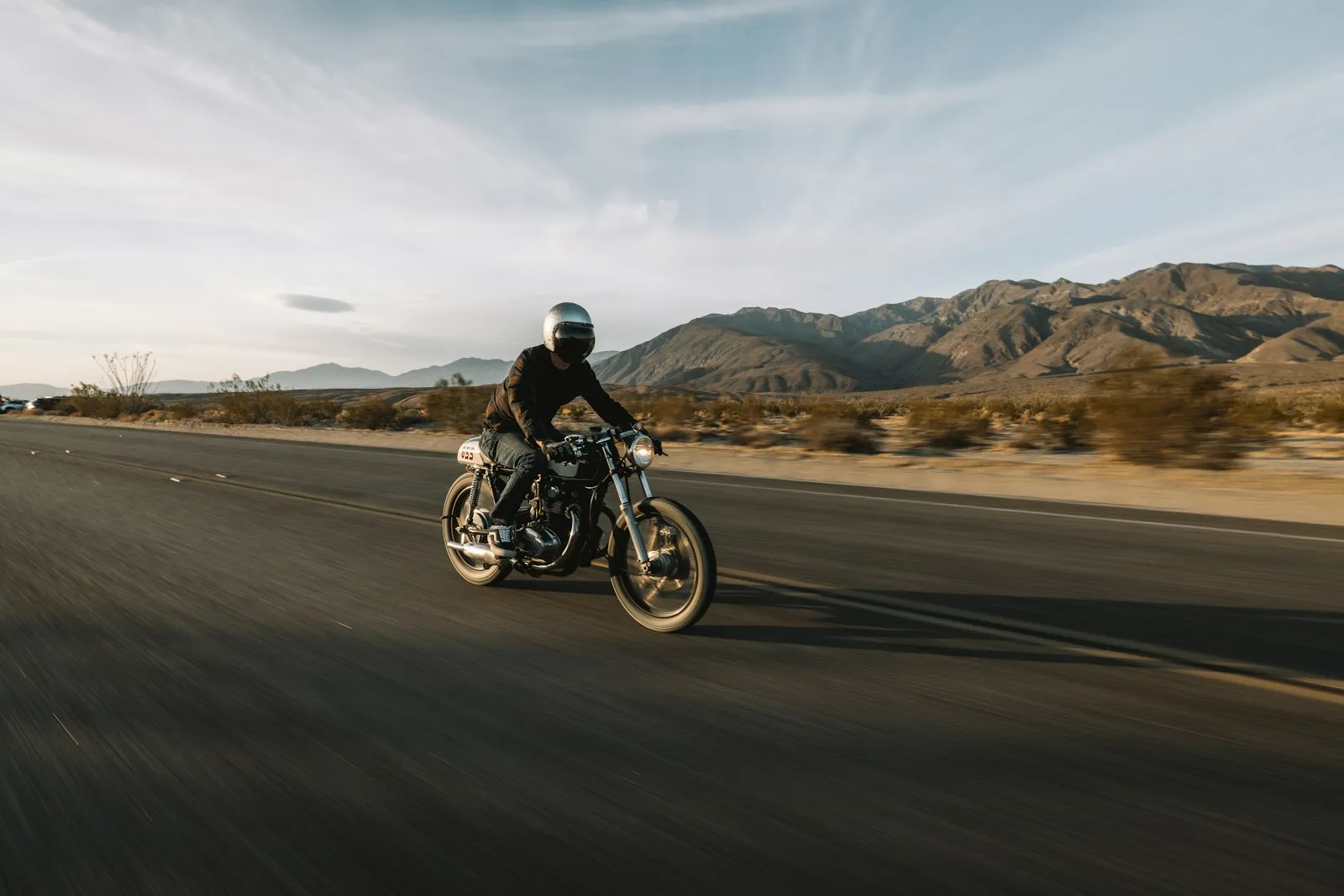 Motorcycle Accident Lawyer in Bellerose – man riding a motorcycle on the road