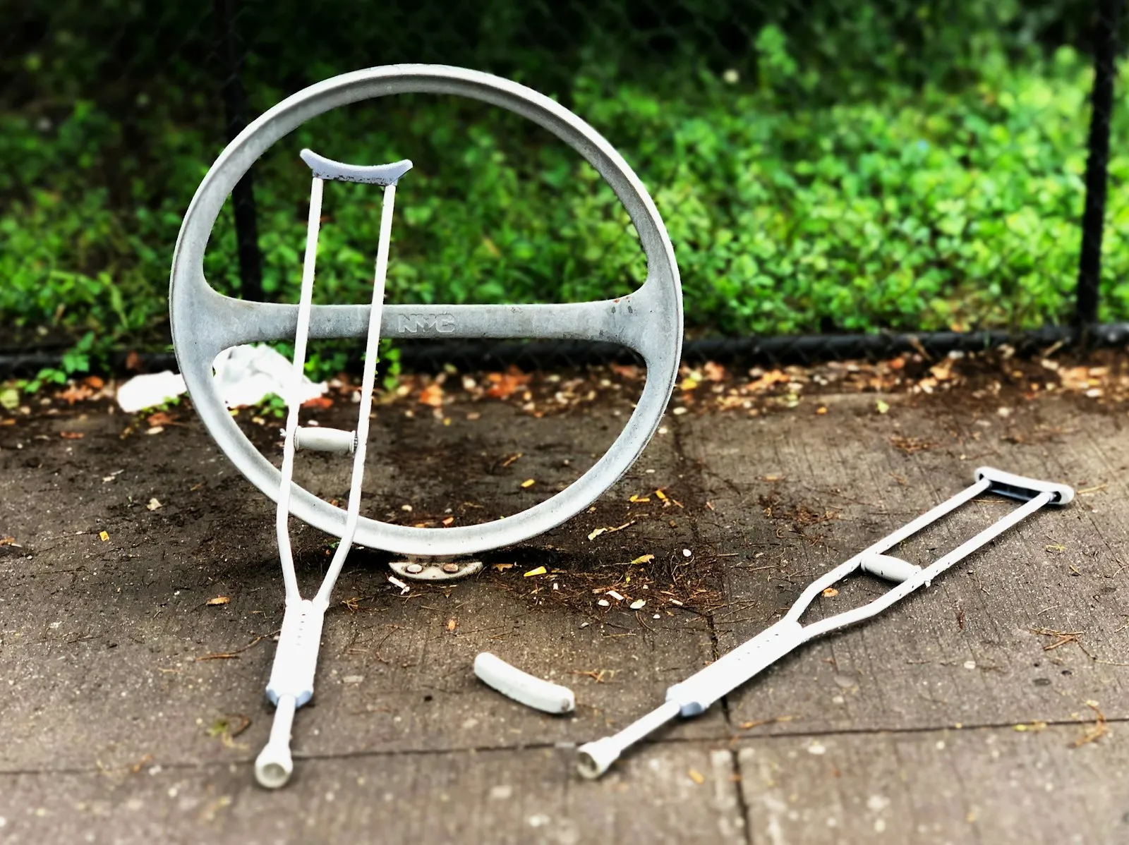 Personal Injury Lawyer in Bellerose – pair of crutches on pavement