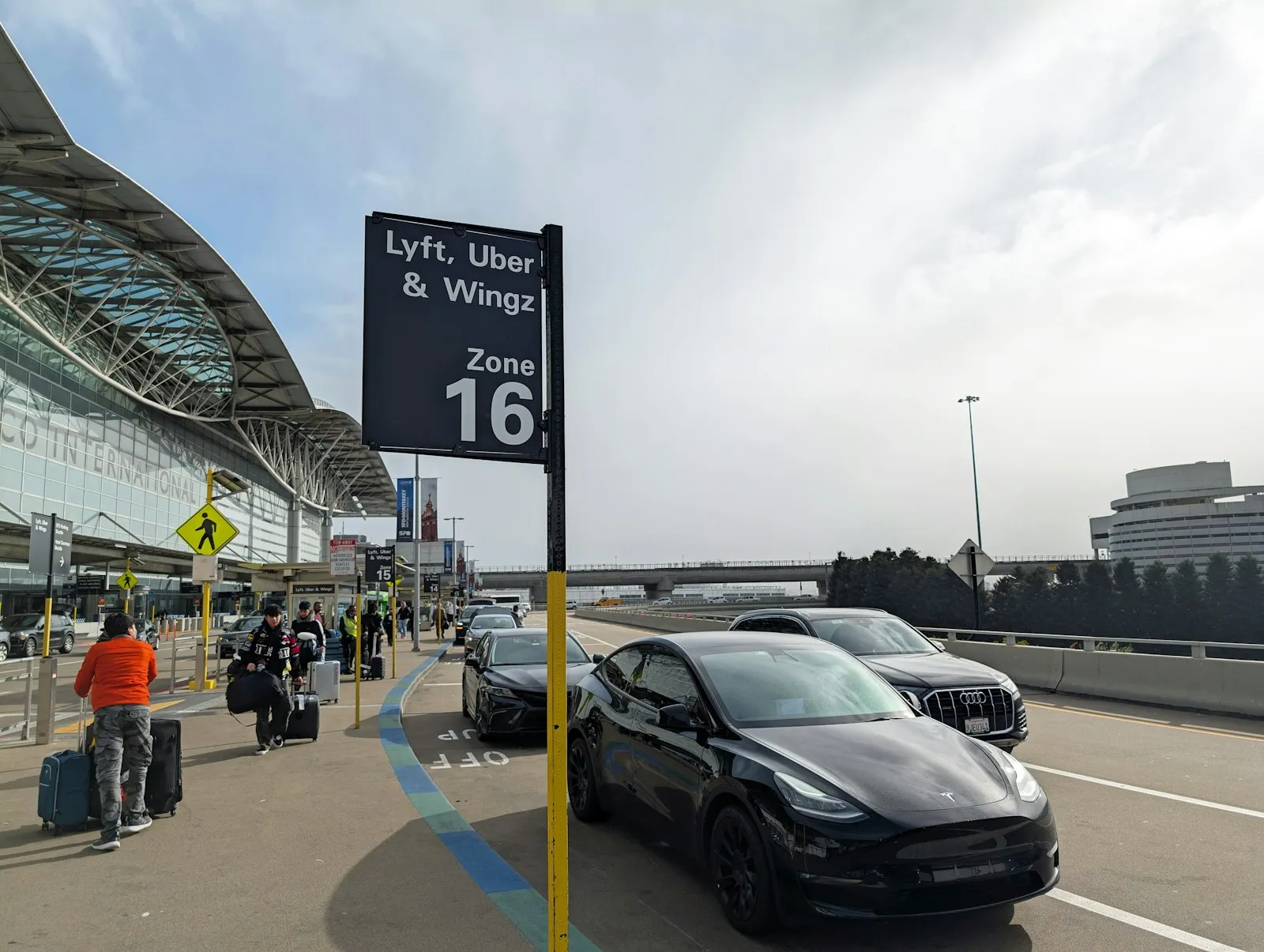 Car stopped at an airport curb