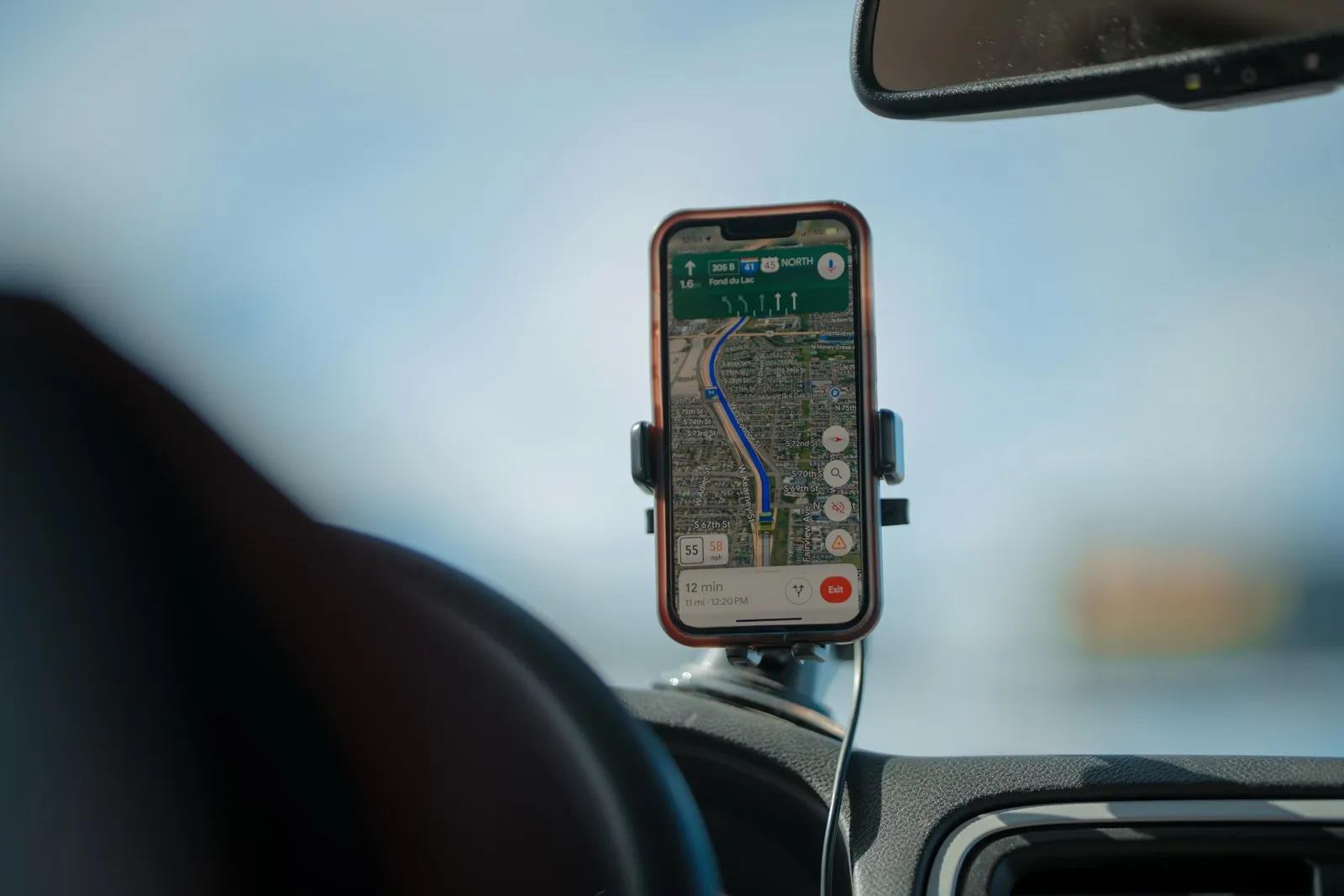 Navigation app showing a route on a car dashboard