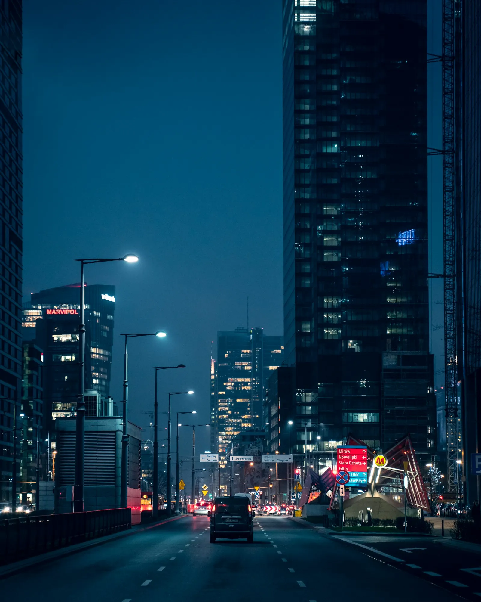 Cars on a city road at night