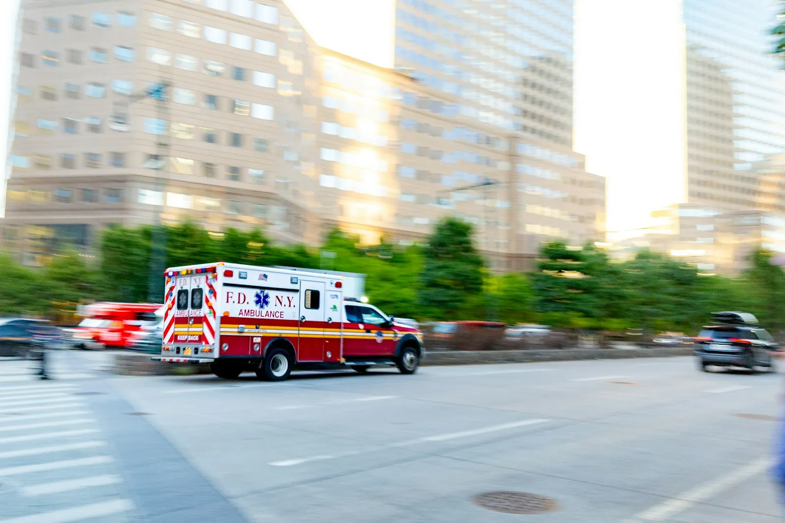 Ambulance driving down a city street