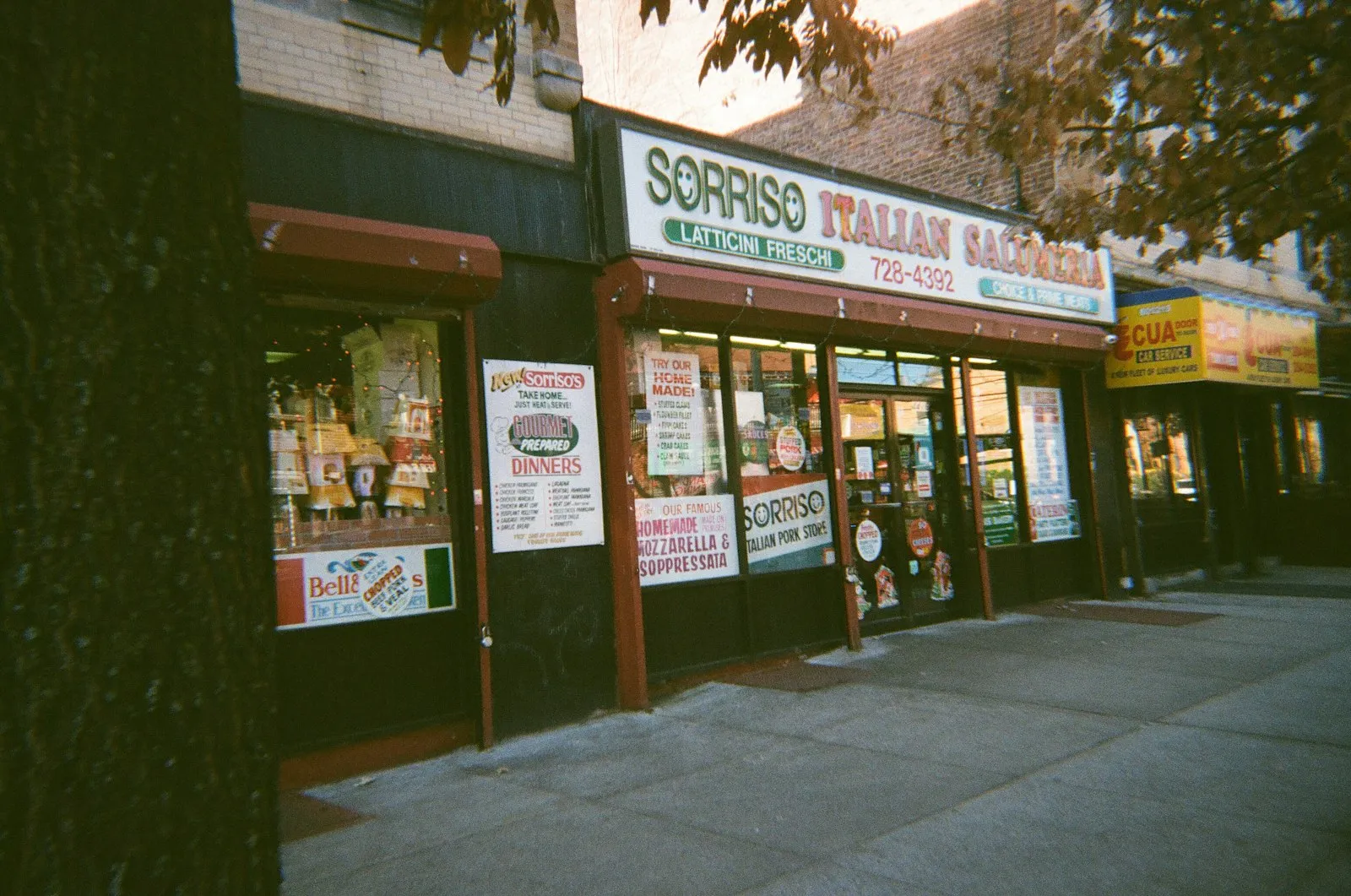 Italian deli storefront on a street in Astoria, Queens