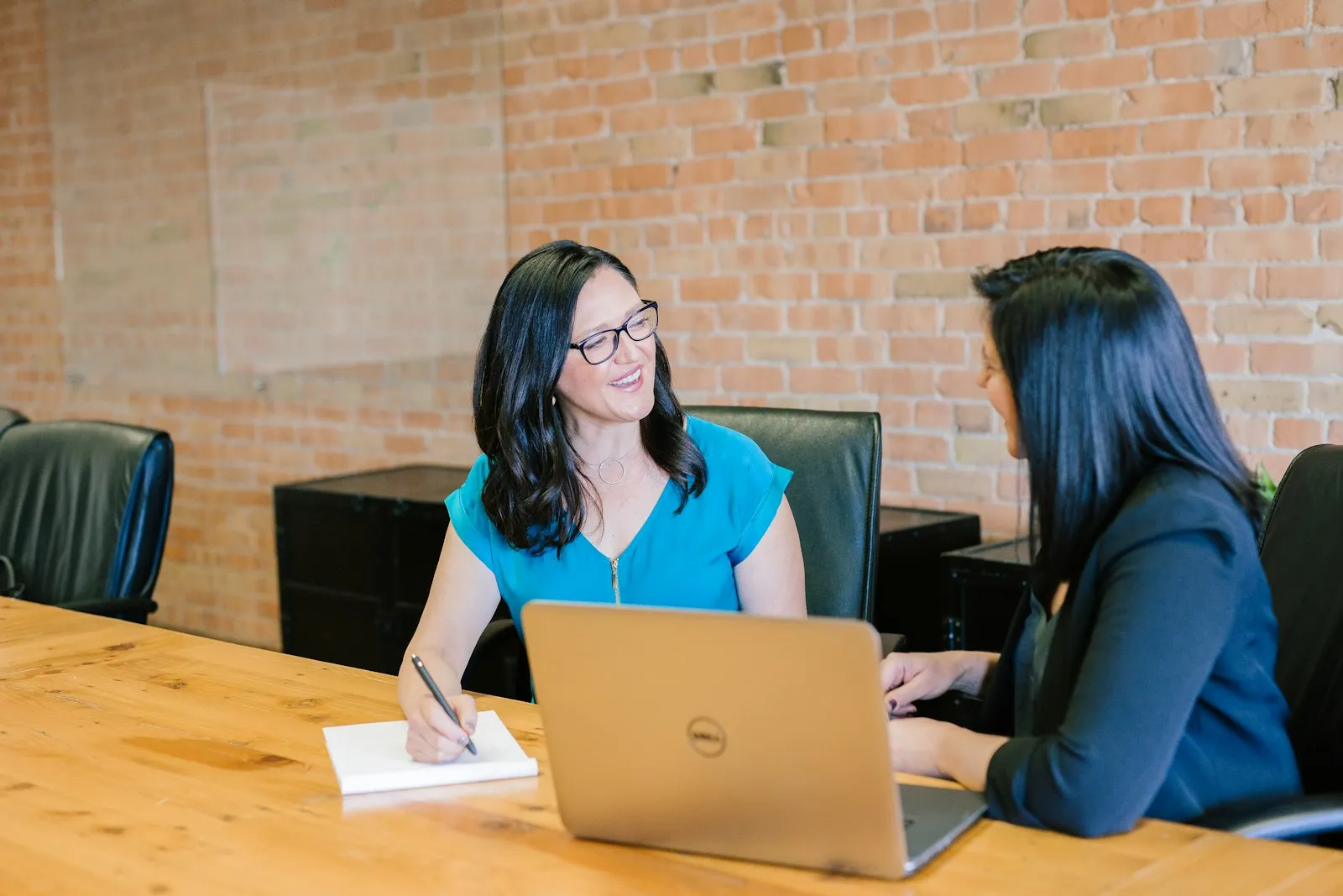 Client meeting with an attorney across a desk
