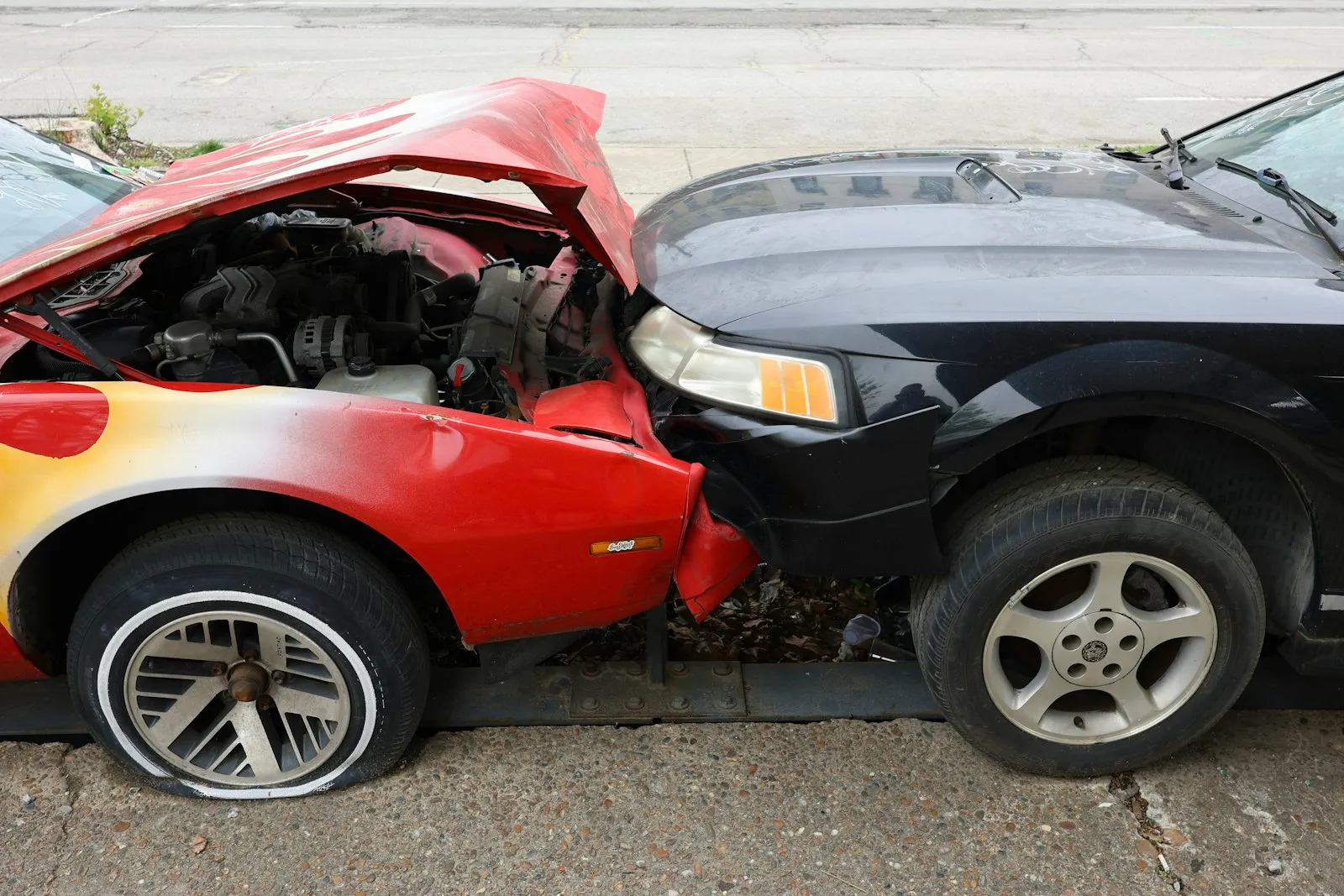 Aftermath of a frontal collision between two cars