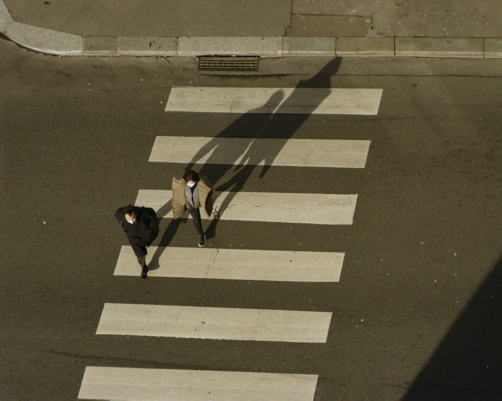 Pedestrians crossing at a city crosswalk