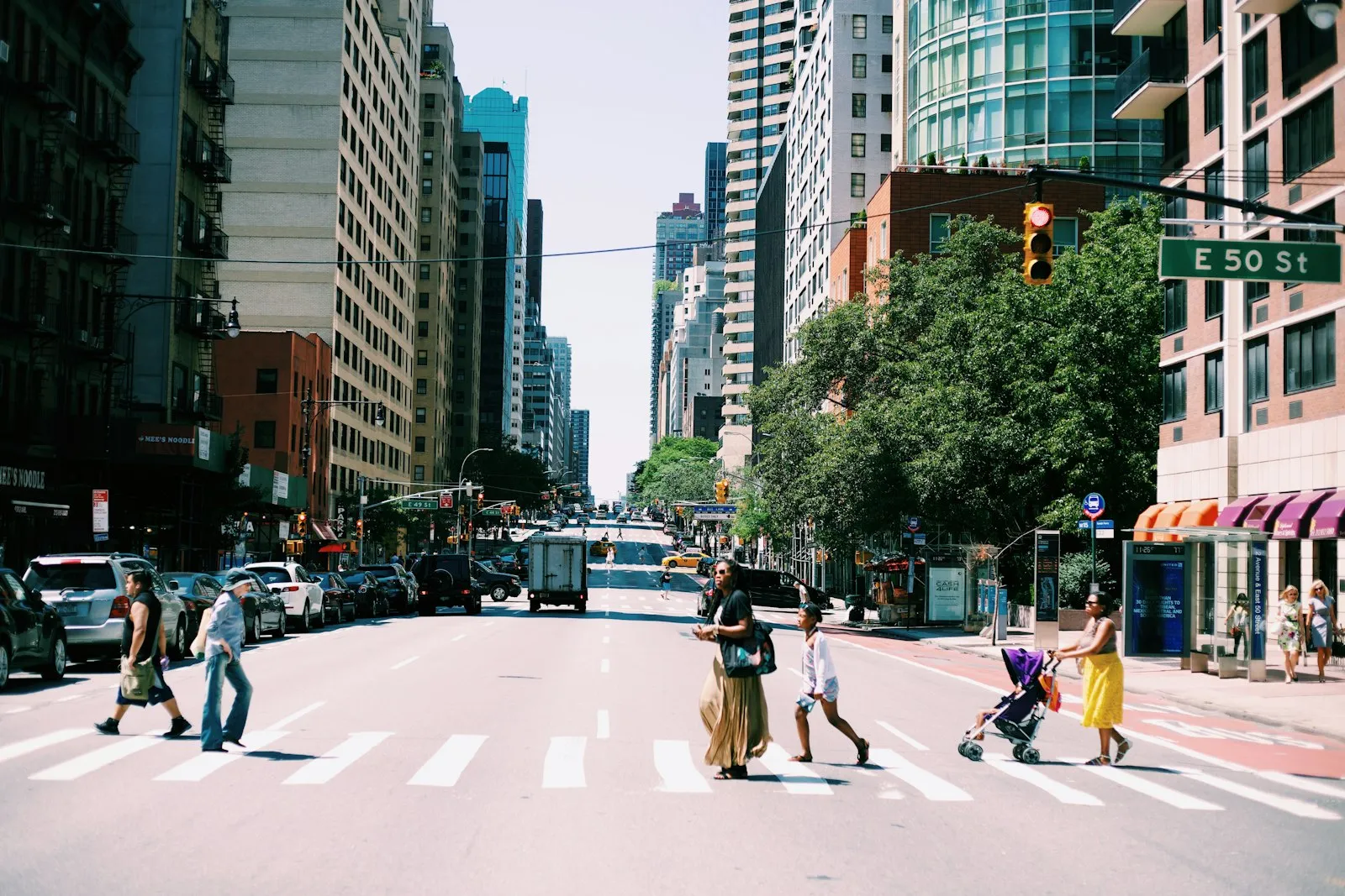 People crossing a city street in a crosswalk