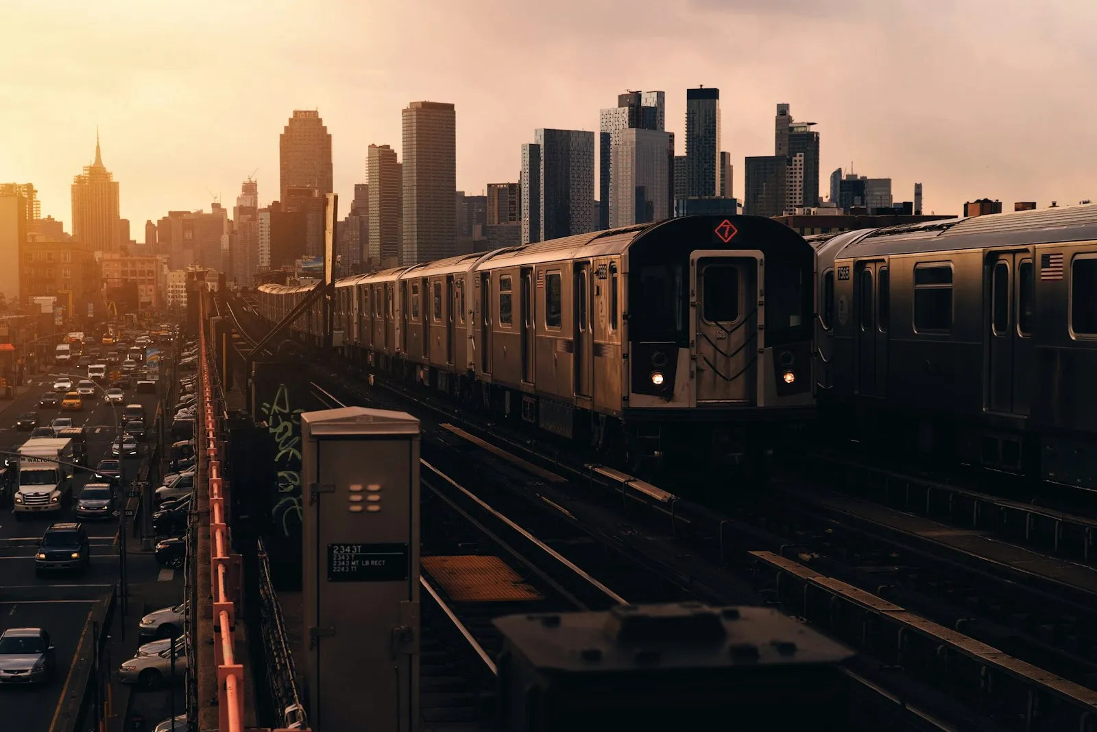 Train approaching beside high-rise buildings