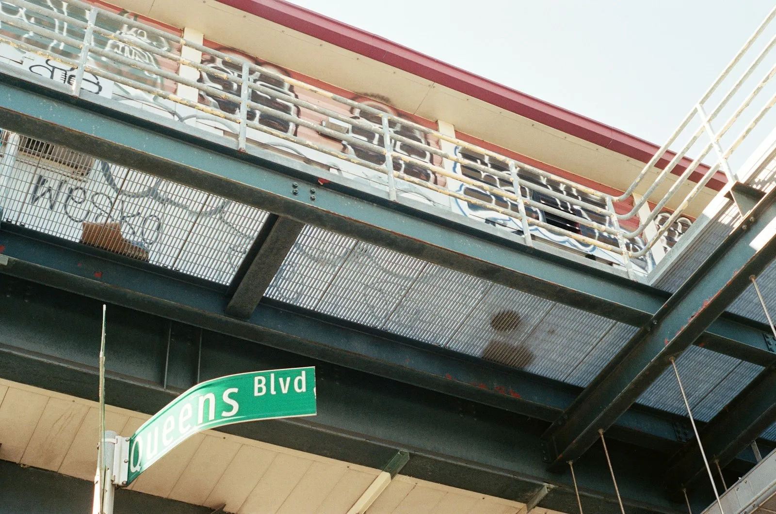 Queens Blvd street sign under the elevated 7 train
