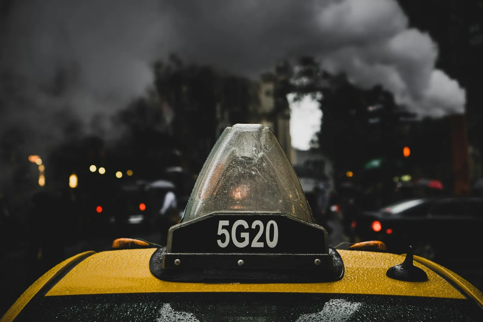 Taxi on a wet road at night