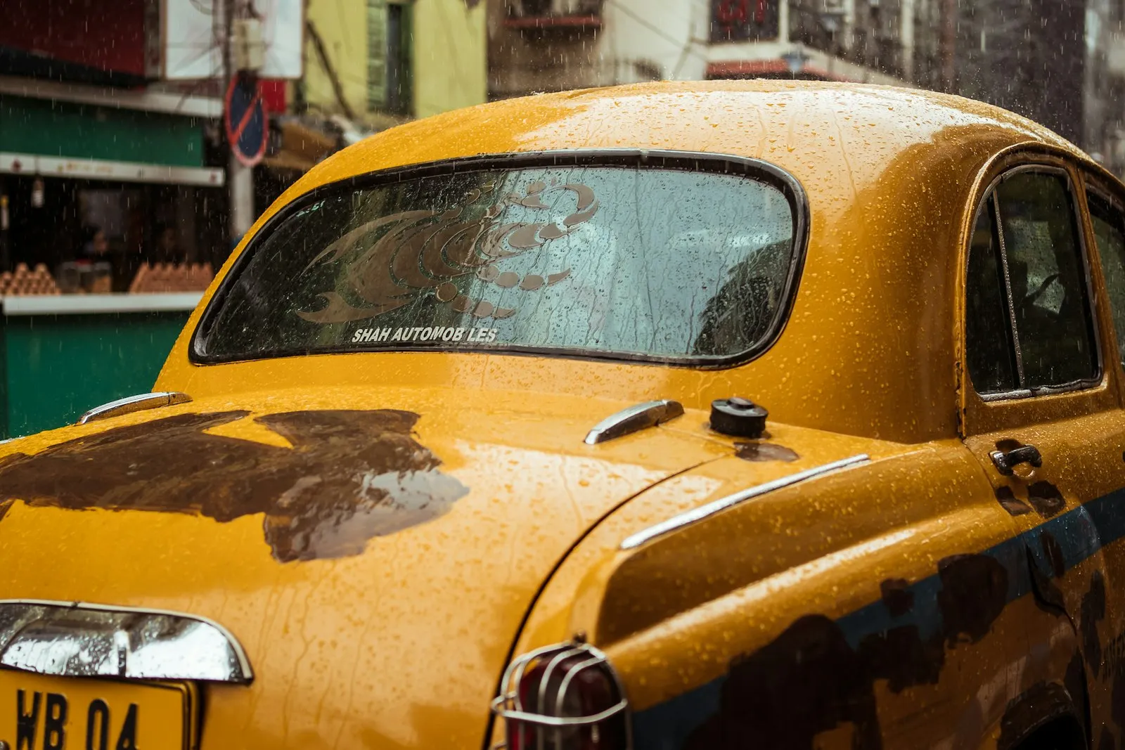 Close-up of a taxi cab in the rain