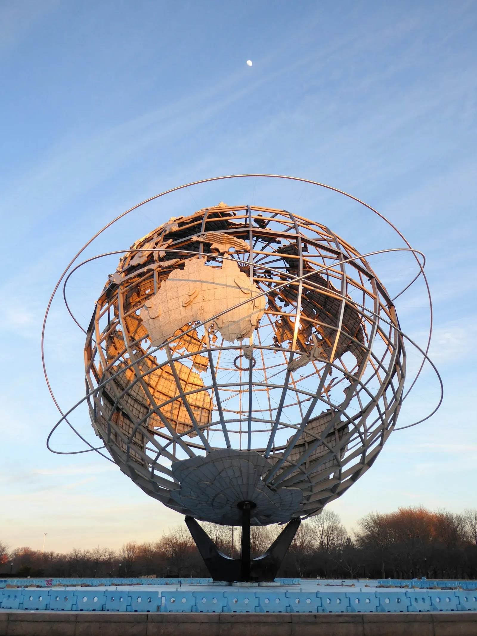 The steel Unisphere globe against a blue sky in Corona, Queens