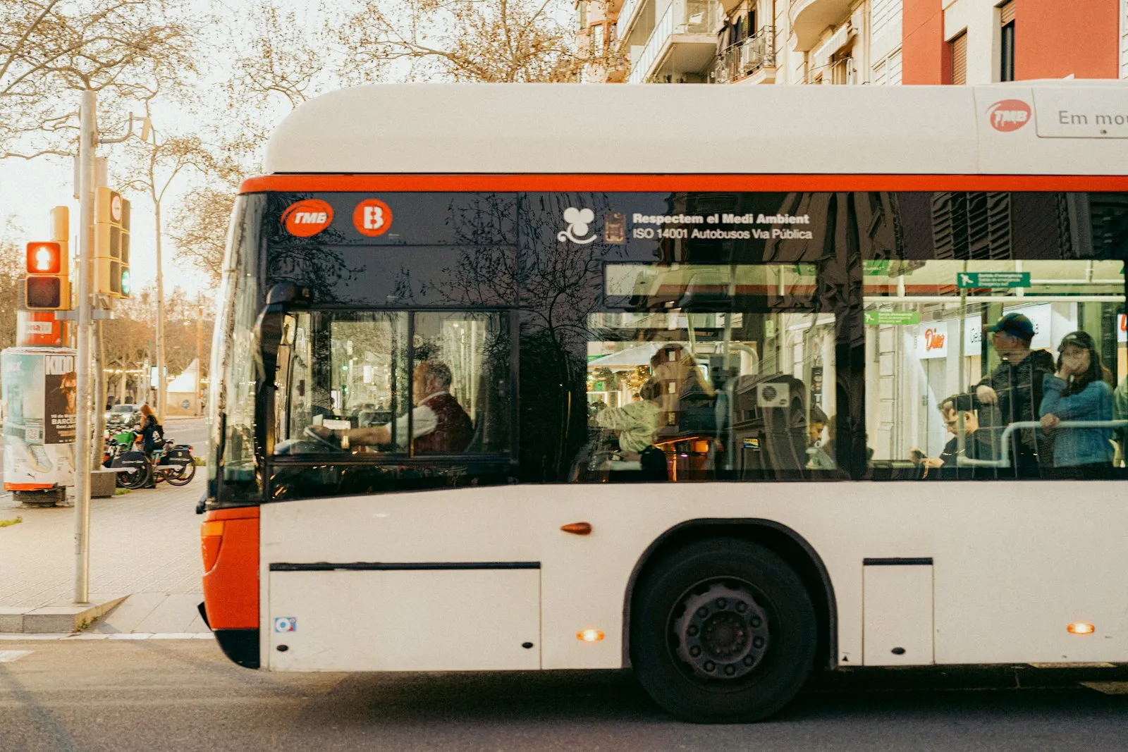 City bus driving down a busy street