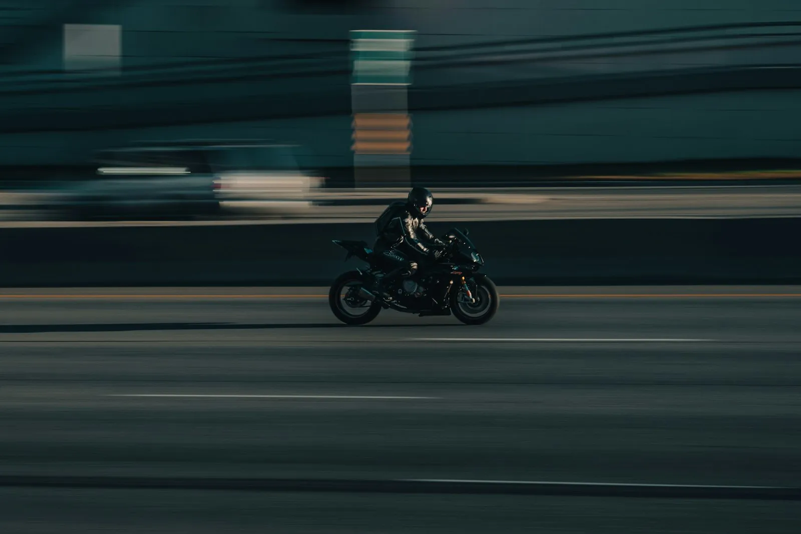 Motorcyclist riding on a city street
