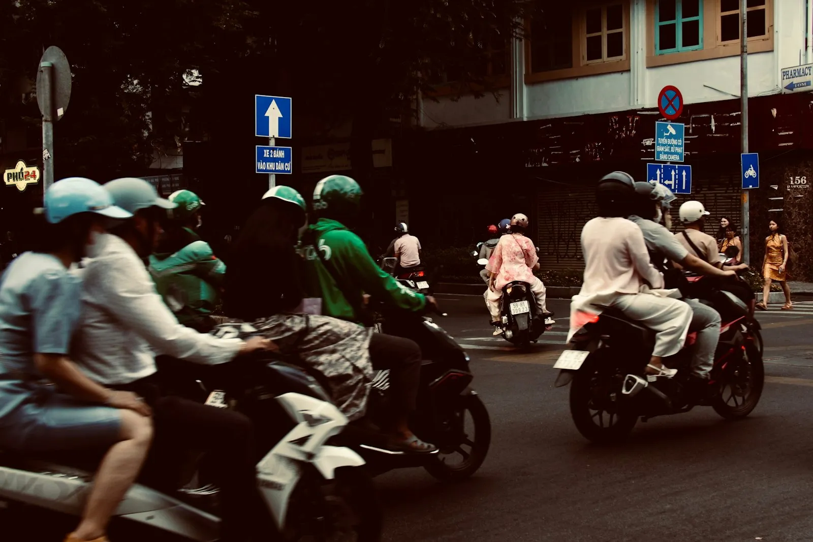 Motorcycles riding through heavy city traffic