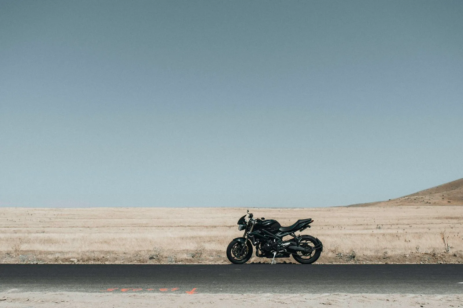 Motorcycle parked on the side of the road