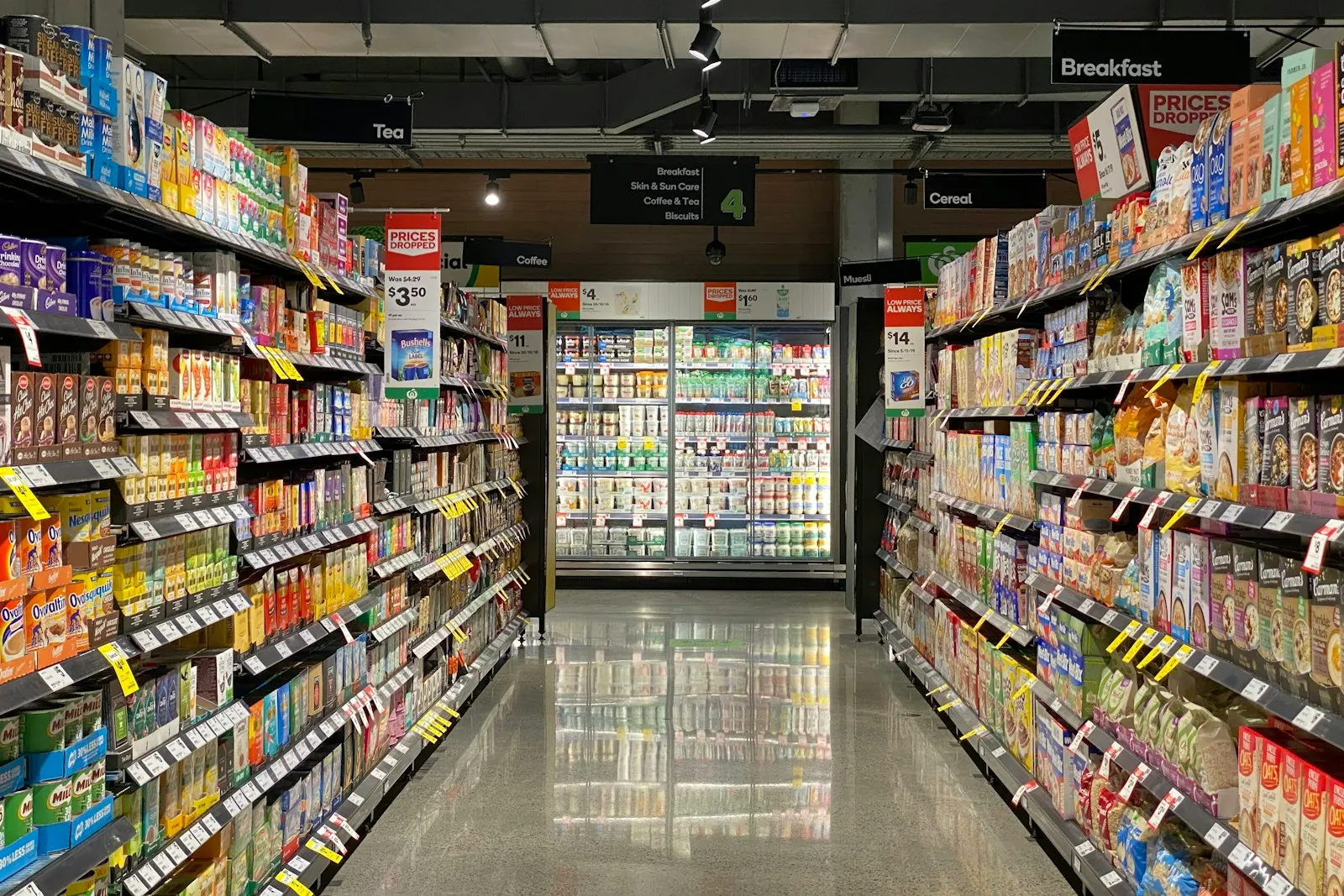 Grocery store aisle with stocked shelves