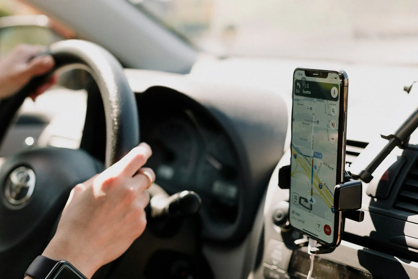 Driver looking at a phone while behind the wheel