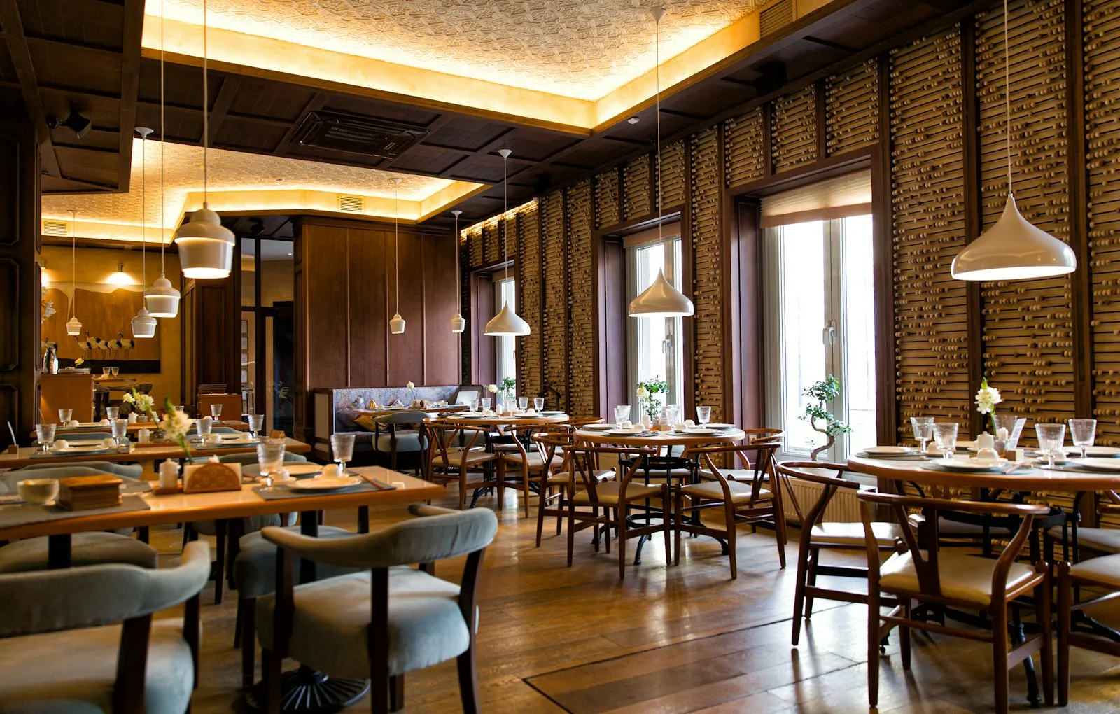 Restaurant dining room with wooden tables and warm lighting, illustrating a slip and fall lawyer guide