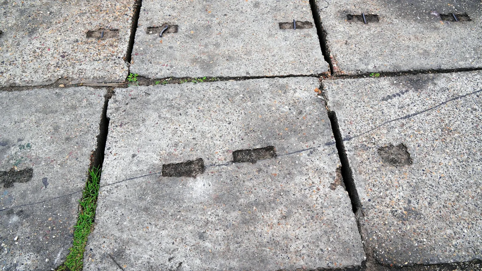 Sidewalk Accident Lawyer in Bellerose – cracked concrete sidewalk slabs