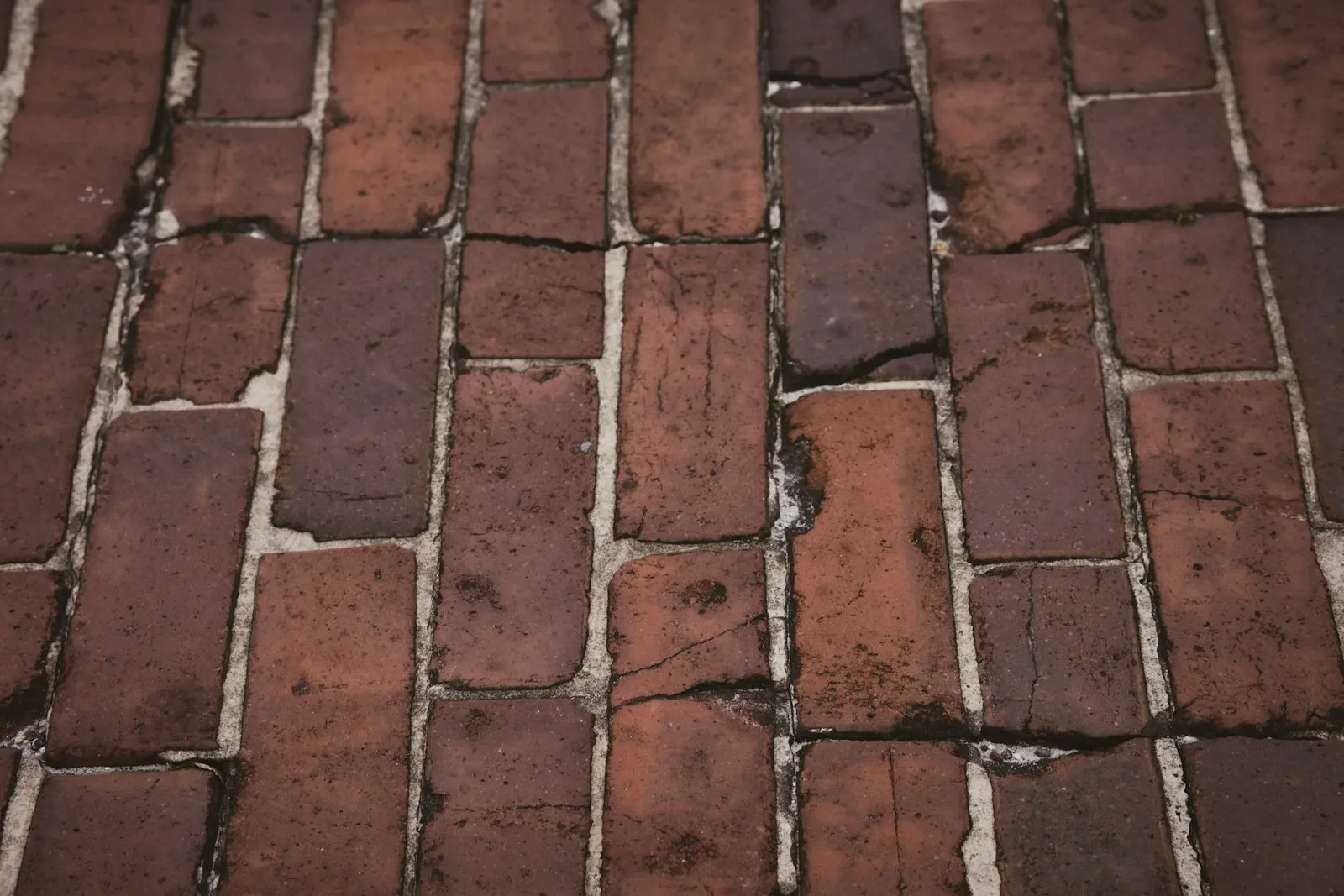 Sidewalk Accident Lawyer in Bellerose – close-up of an uneven brick sidewalk