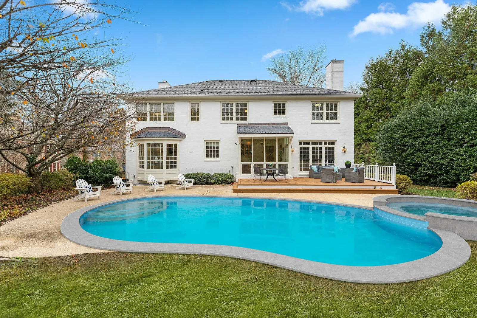 Backyard swimming pool beside a two-story house, illustrating claims handled by a swimming pool accident lawyer