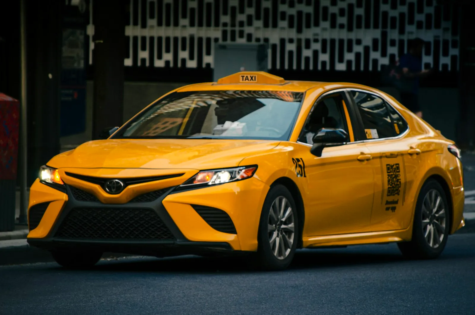 Taxi Accident Lawyer in Bellerose – taxi driving on a city street