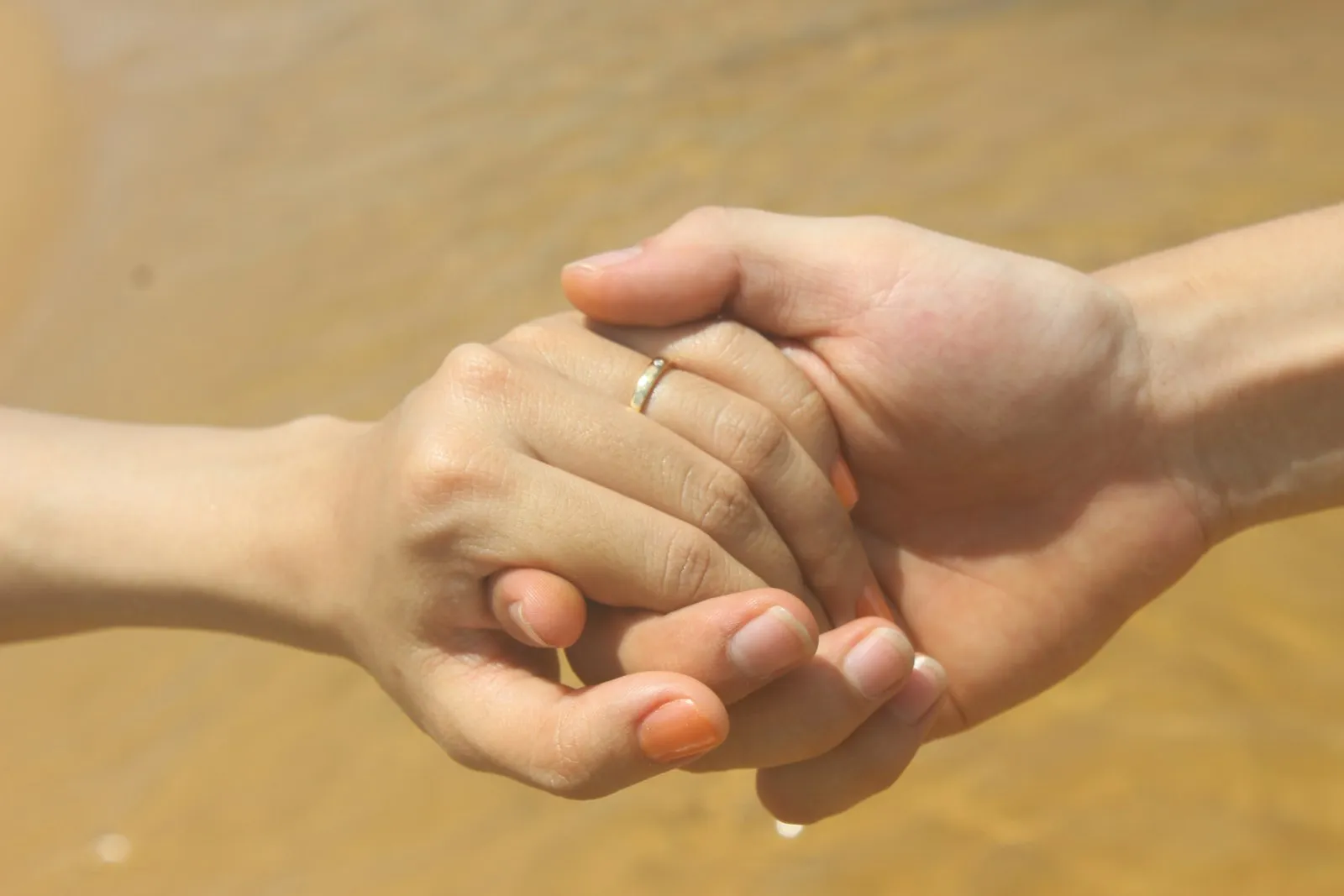 Wrongful Death Lawyer in Bellerose – two people holding hands in comfort